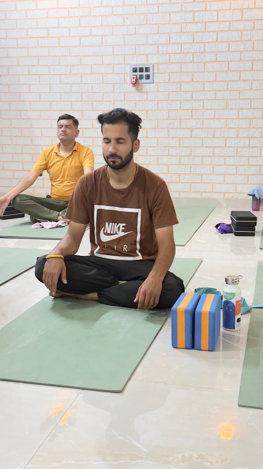 Two students in seated meditation