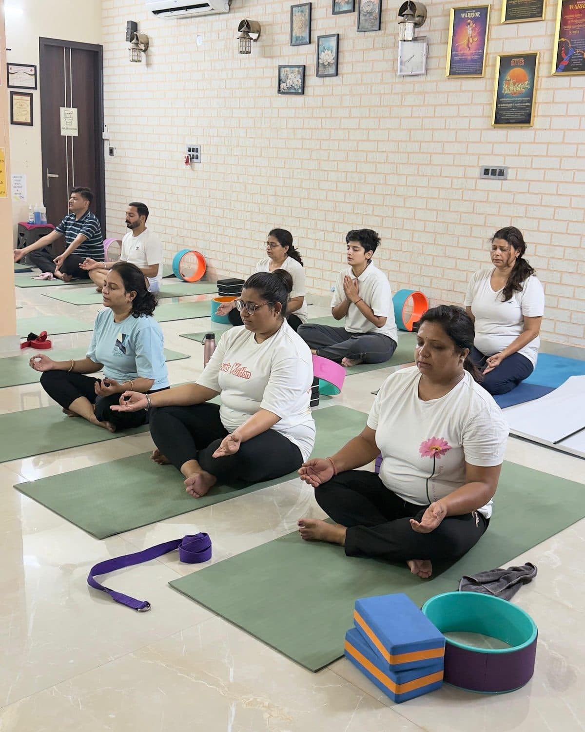 A class seated in meditation at the Jalandhar studio